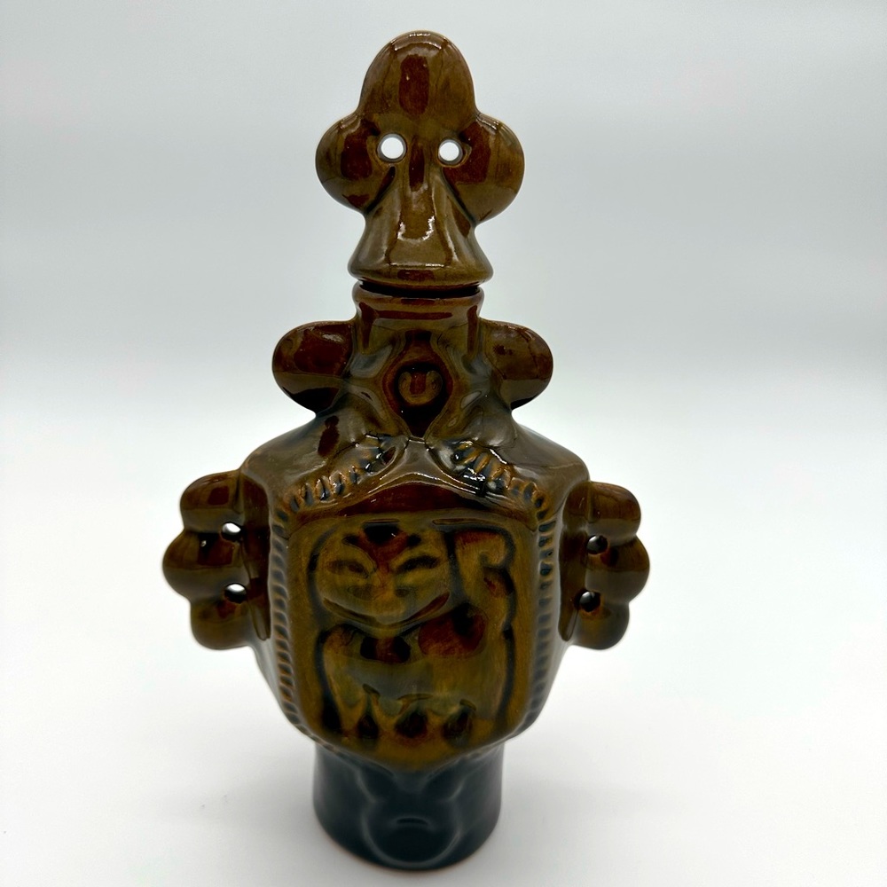 Asian style animal motif ceramic vessel with topper.